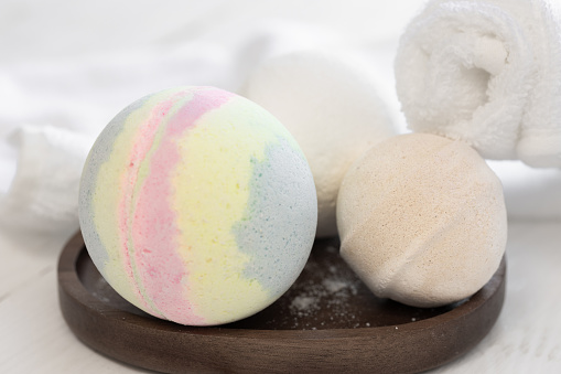 Spa composition with bath bombs and towels, close-up, body care and relaxation concept.