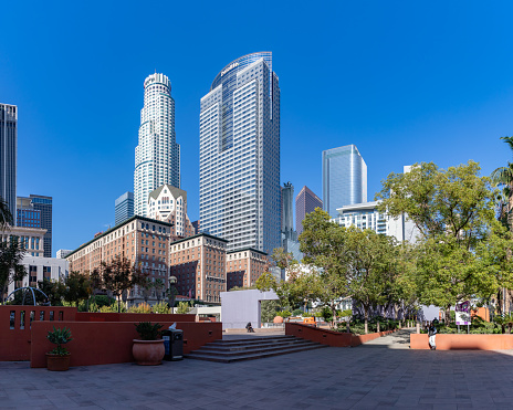 Los Angeles, United States - November 18, 2022: A picture of Pershing Square, being overlooked by the U.S. Bank Tower and the Deloitte building or Gas Company Tower.