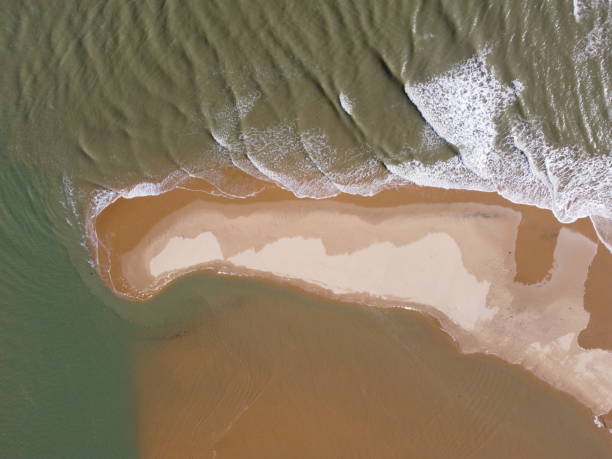 istock Aerial view of a beach with waves 1472349748