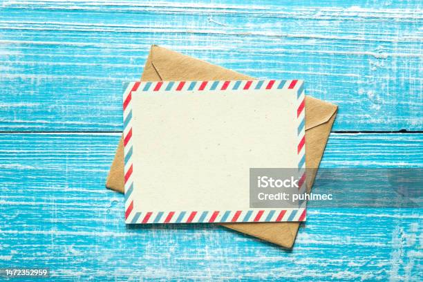 Envelope And Postcard For Text On A Blue Wooden Background Top View Stock Photo - Download Image Now