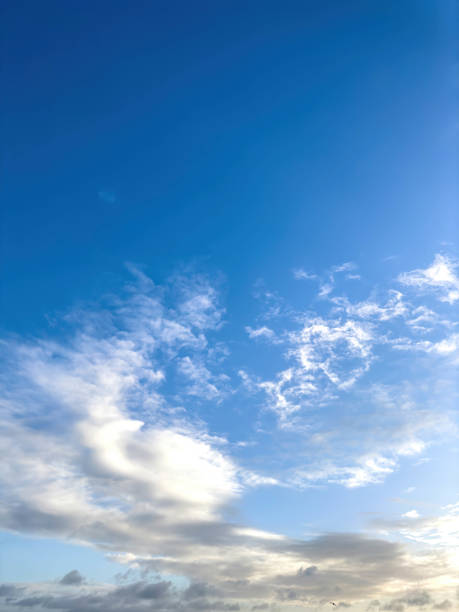 Blue skies with white clouds, copy space. stock photo