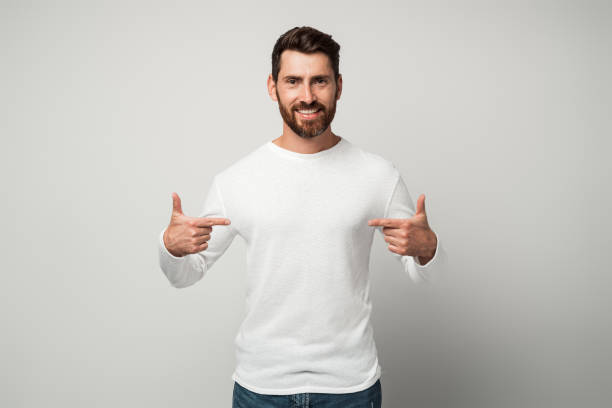 istock Self-confident narcissistic man smiling satisfied and pointing himself 1472353613