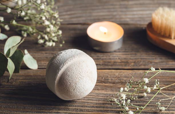 istock Spa composition with bath bomb, candle and dried flowers. 1472353744
