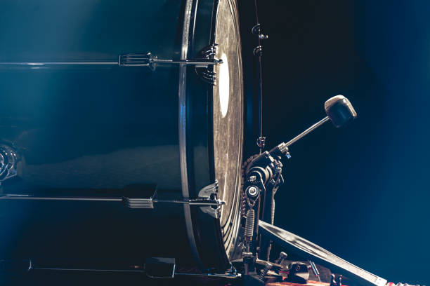 istock Bass drum with pedal, musical instrument on black background. 1472354331