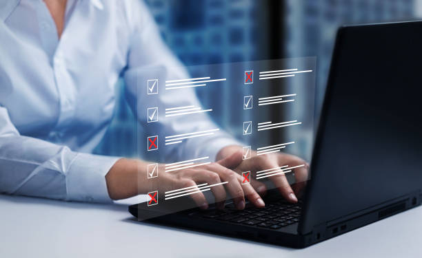 istock Survey form, check marks on checklist, filling online form and answering questions concept. 1472359066