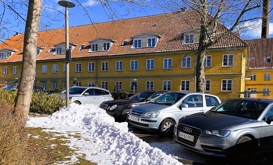 The photo was taken 03/08/2022 in Hillerød Denmark. Hillerød Hospital can be seen in the backgrounds. Finding a place to park your car is been an issue in many Danish Hospitals.
