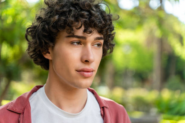 istock Young handsome smiling man looking away during the summer walking 1472361507