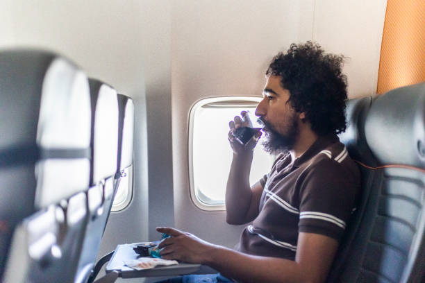 istock Black man having meal on commercial flight 1472364724