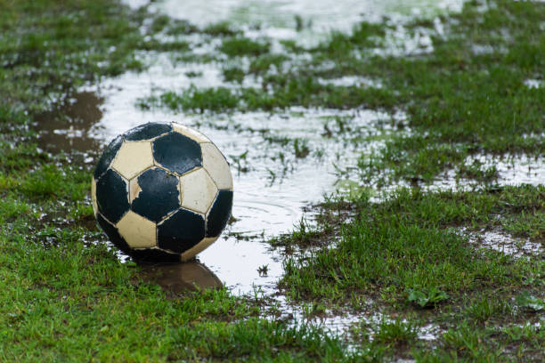 istock Soccer ball in the rain 1472366306
