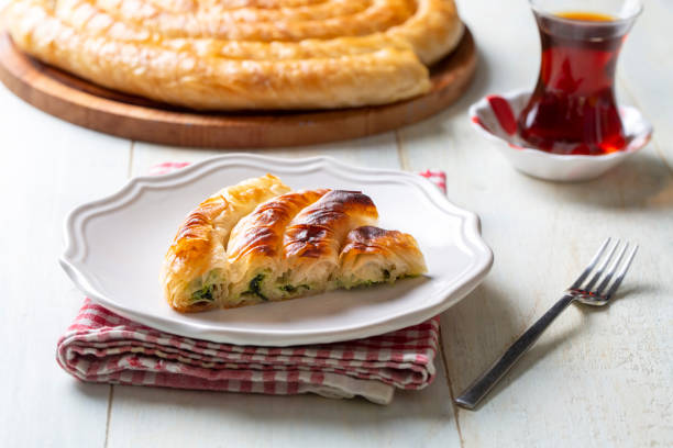 istock Turkish Tepsi Boregi, Round Borek, Tray pastry (Turkish name; rulo borek - ispanakli borek) 1472367789