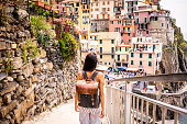 Latin woman visiting beautiful town in Cinque Terre coast, Italy