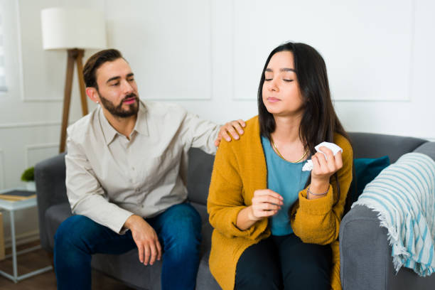 istock Depressed wife having marriage problems with her husband and crying 1472371241