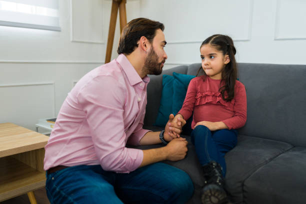 istock Sad man telling his daughter about moving out after a divorce 1472372436