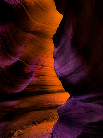 Sunbeams and sand falls in Antelope canyon