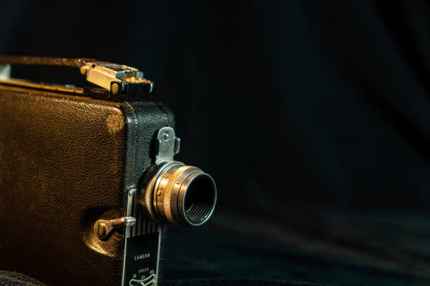 istock Vintage film camera with black background 1472376776