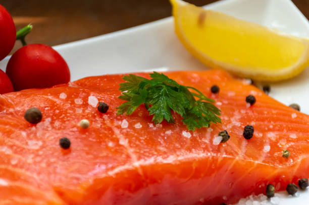 istock Nice piece of salmon with ingredients for cooking 1472378505
