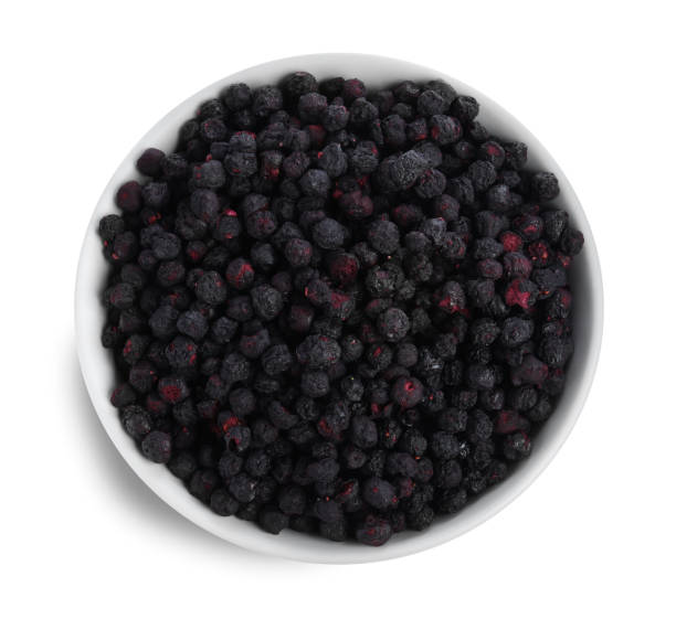 istock Freeze dried blueberries in bowl on white background, top view 1472379402