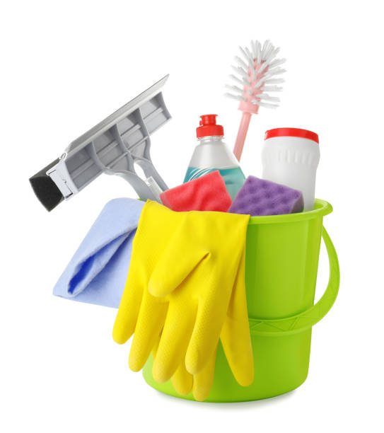 istock Green plastic bucket with different cleaning products isolated on white 1472382124