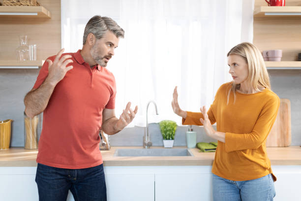 istock Emotional spouses having fight at home, shouting at each other 1472384427