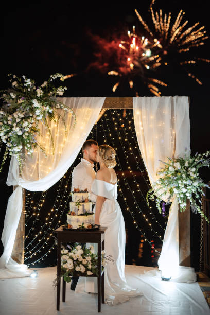 istock newlyweds happily cut and taste the wedding cake 1472384827
