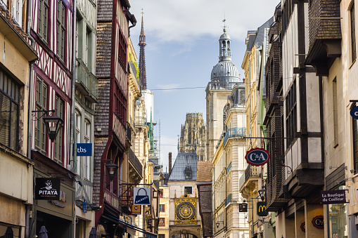 Rouen, France - October 01, 2022: Rue du Gros Horloge with the famous astronomical clock. Rouen is the prefecture of the department of Seine-Maritime, formerly one of the largest cities of medieval Europe