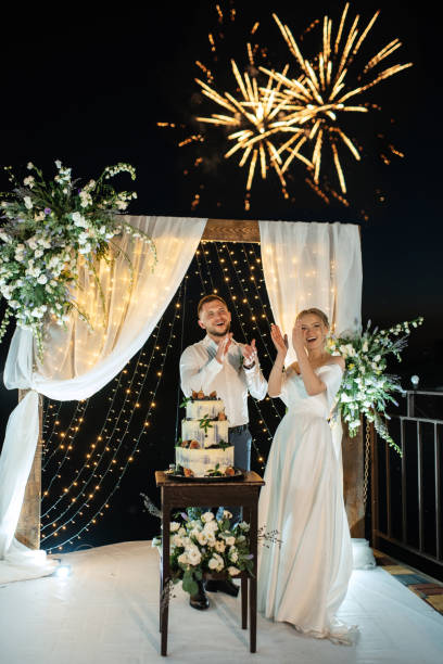 istock newlyweds happily cut and taste the wedding cake 1472387828