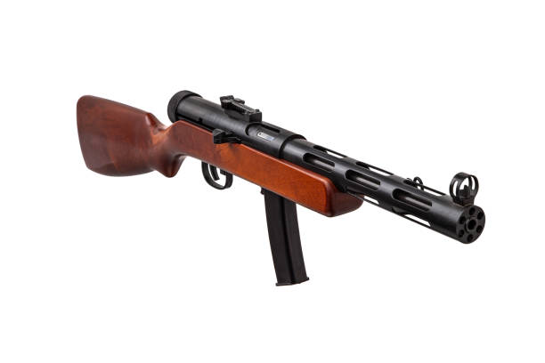 istock Vintage submachine gun from the Second World War. Automatic weapon with a wooden butt. Isolate on a white background. 1472392902