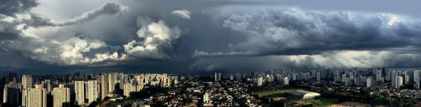 Grey black clouds of a storm come in the background.