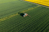 Aerial view of a tractor works in the field