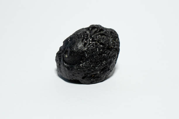 istock Indochinite meteorite black space rock cosmos tektite 1472399359