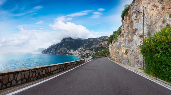 Scenic Road on Rocky Cliffs and Mountain Landscape by the Tyrrhenian Sea. Amalfi Coast, Positano, Italy. Adventure Travel. Cloudy Sky Art Render