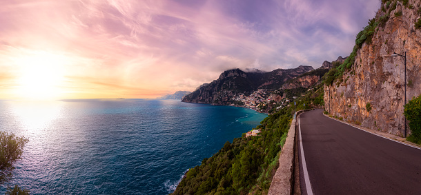 Scenic Road on Rocky Cliffs and Mountain Landscape by the Tyrrhenian Sea. Amalfi Coast, Positano, Italy. Adventure Travel. Sunset Sky Art Render