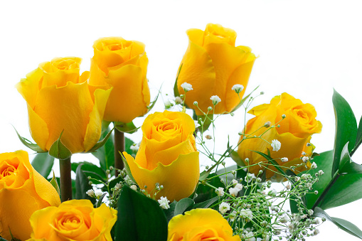 A bouquet of yellow and white roses.