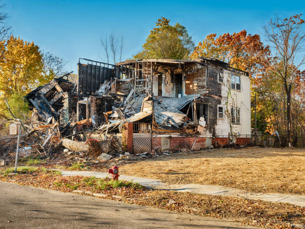 Destroyed Home In Highland Park Detroit, Michigan - October 31, 2020: A house is partially destroyed and gutted after arsonists burned the main building. highland park michigan stock pictures, royalty-free photos & images