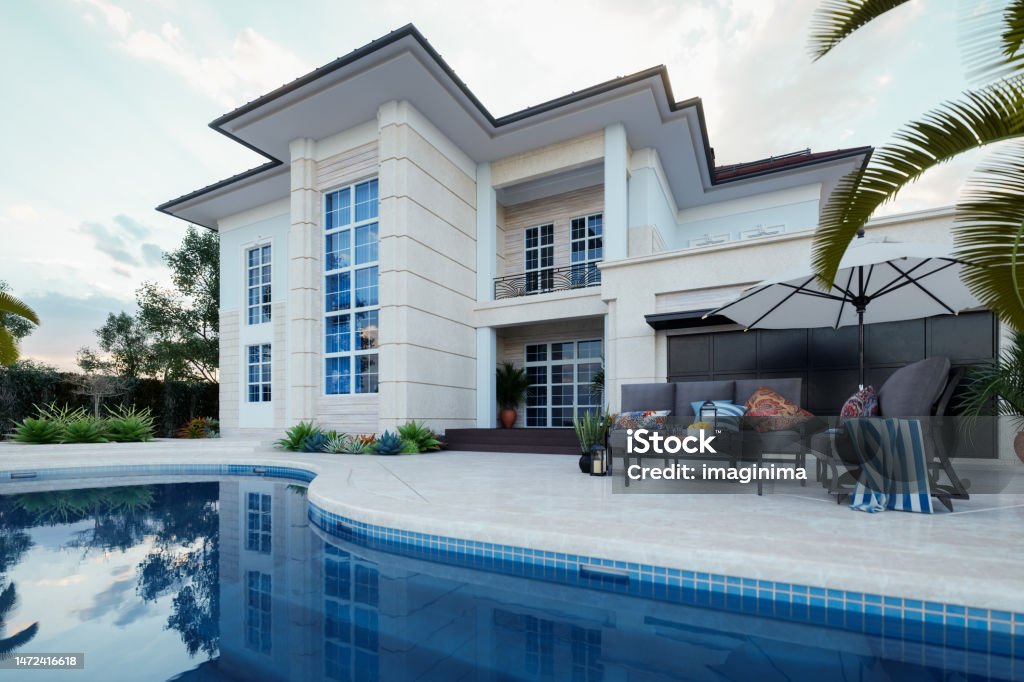 Modern Luxury House With Swimming Pool Luxury villa with swimming pool and patio furniture. Beach Stock Photo