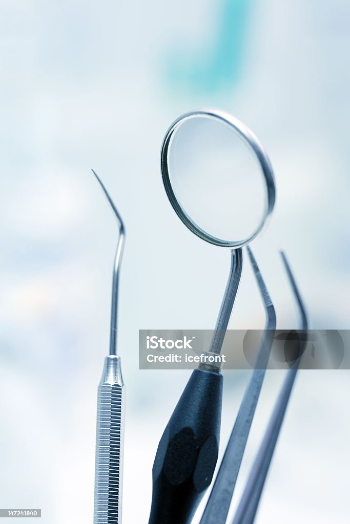 Close-up view of precision dental tools  Dentist tools in blue light (shallow DOF) Blue Stock Photo