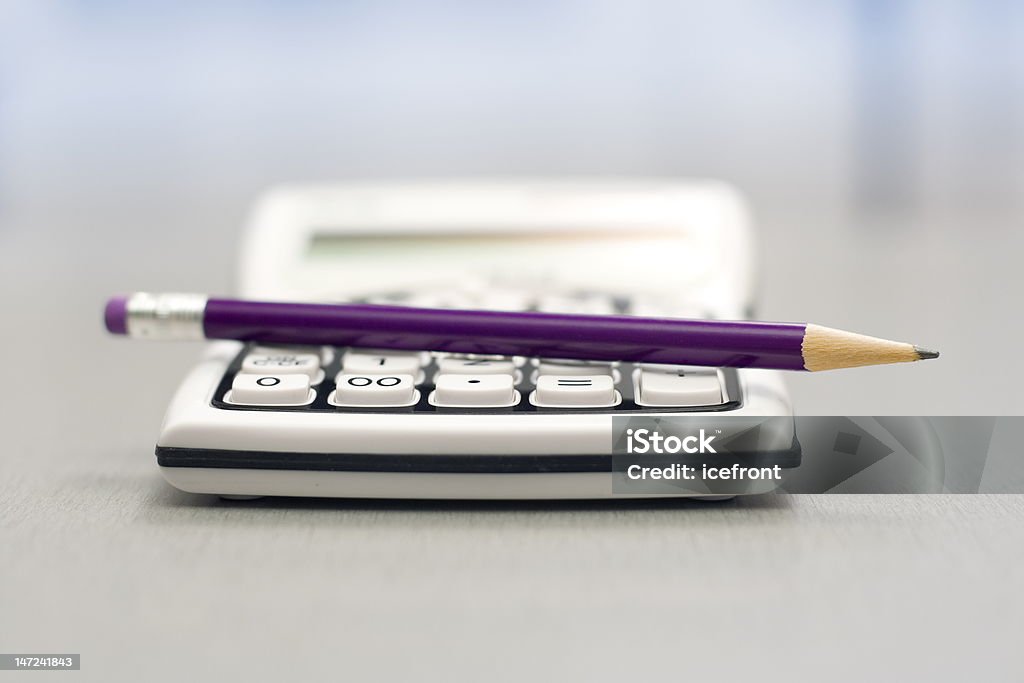 Computational objects Computational objects - pocket calculator and graphite pencil Balance Stock Photo