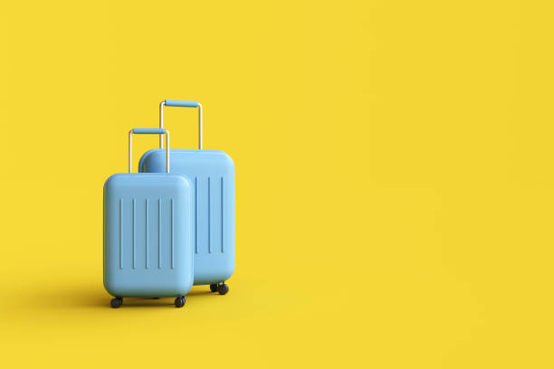 istock Travel suitcase on yellow background. 1472421670