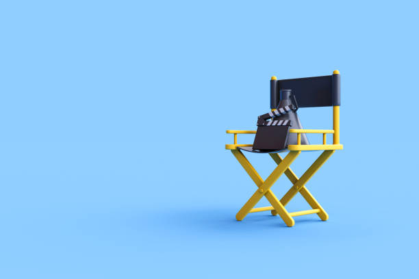 istock Director chair, clapperboard and megaphone on blue background 1472421680