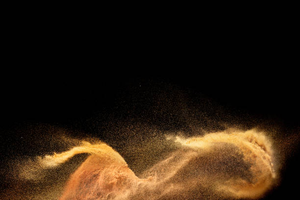 istock Sand explosion isolated on black background. Freeze motion of sandy dust splash. 1472422739