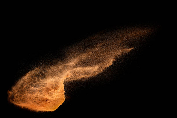 istock Sand explosion isolated on black background. Freeze motion of sandy dust splash. 1472422740