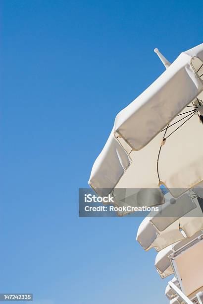 White Sun Umbrellas Stock Photo - Download Image Now - Beach, Beauty, Blue