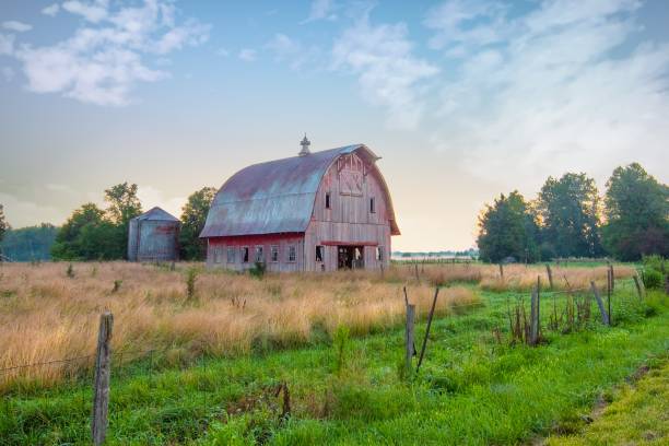istock Old Weathered Red Barn at sunrise-Howard County, Indiana 1472428134