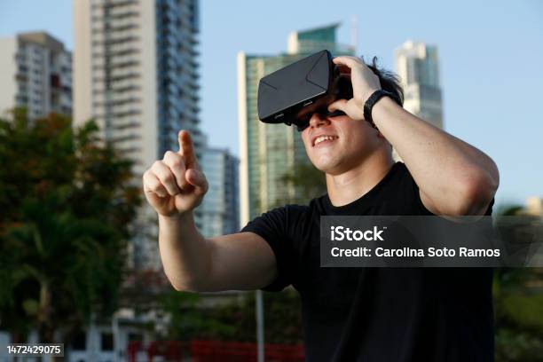 Exploring New Worlds With Virtual Reality Glasses Connecting With A Virtual World In The First Person Immersing Yourself In A Virtual Experience Stock Photo - Download Image Now