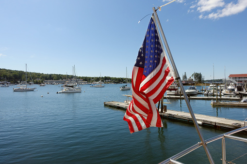 Marina and USA flag in Boothbay Harbor, Maine, USA