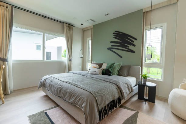 istock Modern bedroom interior with green wall and wall art. 1472439158
