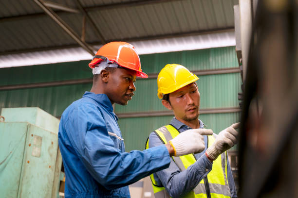 istock Blue collar worker work at machinery factory. 1472441092