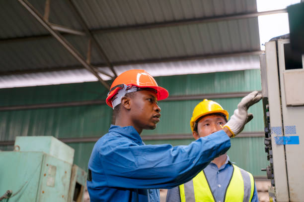 istock Blue collar worker work at machinery factory. 1472441094