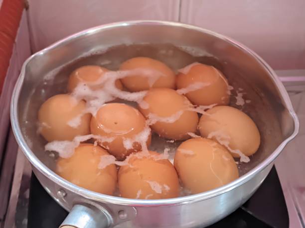 istock boiled eggs with still boiling water in a stainless pan 1472445301