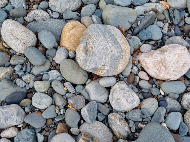 istock water-sharpened stones on the bank of a mountain river. 1472450023